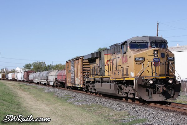 UP AC4400CW 7046 leading freight train MEGEW at Stafford TX