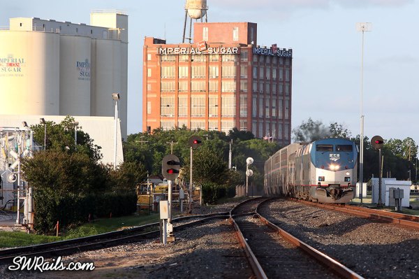 Amtrak P42 64 leads the Sunset Limited through Sugar Land, TX on 6/1/2013.