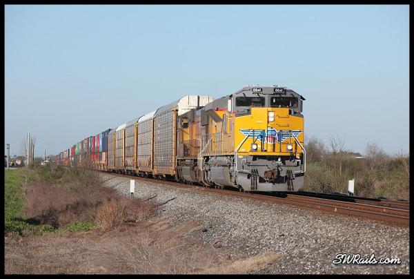 Union Pacific ILBEW led by brand-new SD70AH 8841 at Missouri City TX on 3/18/2014
