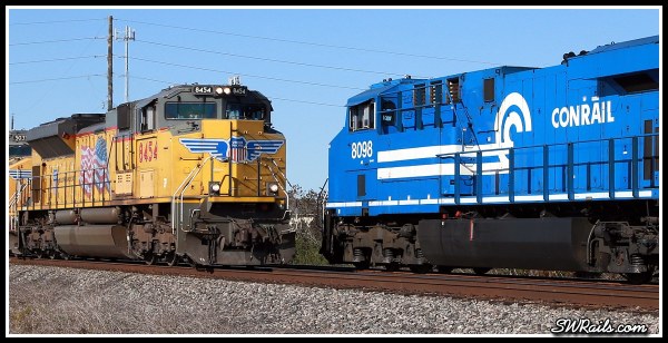 NS 8098, Conrail heritage locomotive,  and UP SD70ACE 8454 at Harlem, TX on 11-24-2014